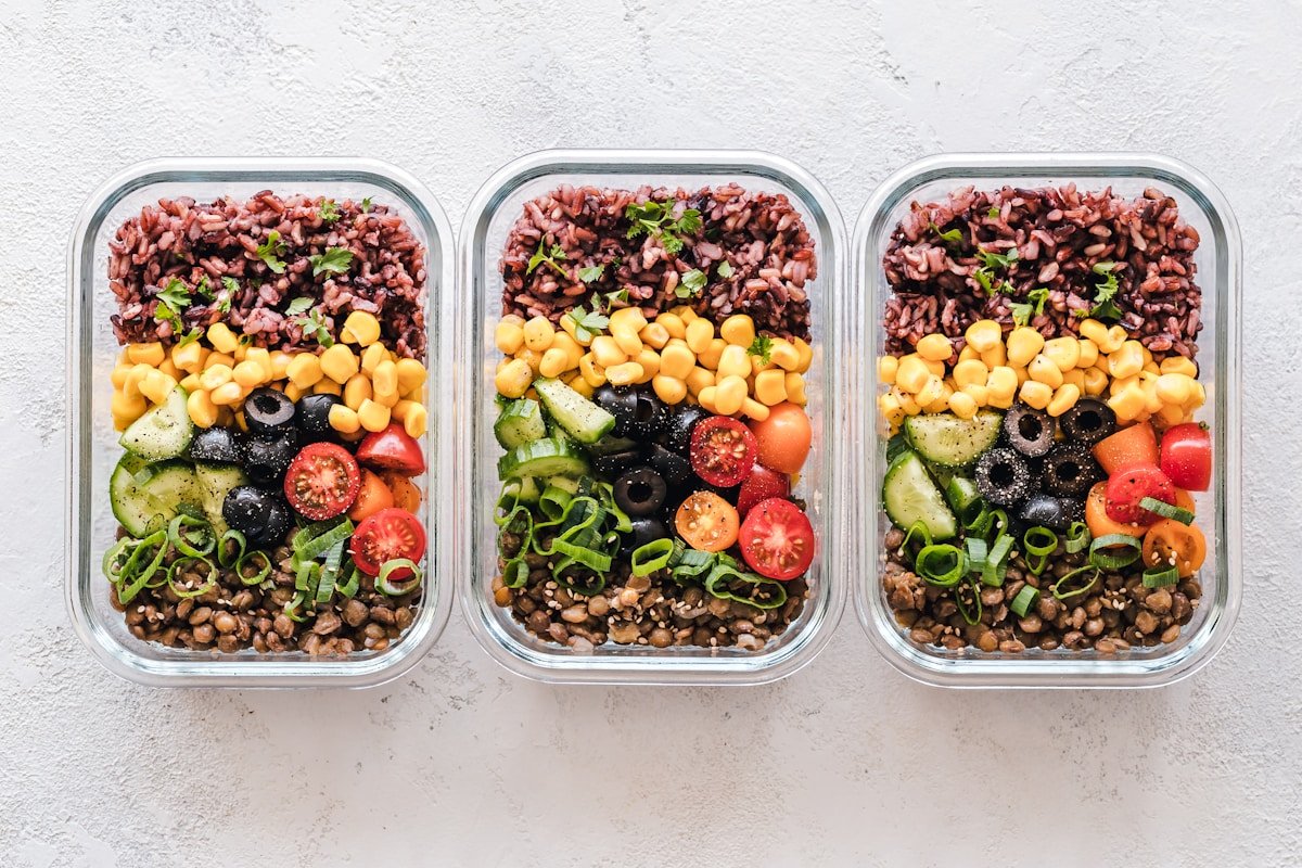 Fresh fruit salads in containers representing affordable healthy meal prep options